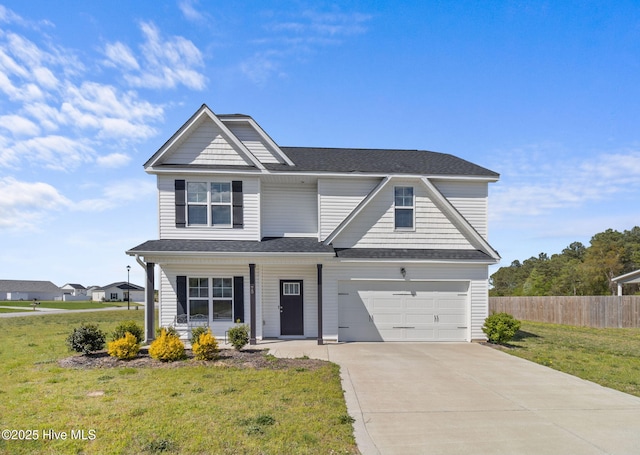 view of front of home with a porch, a garage, and a front yard