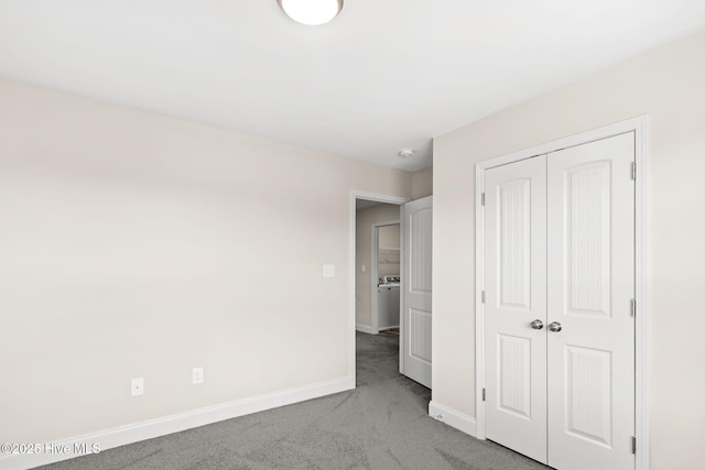 unfurnished bedroom featuring carpet floors and a closet