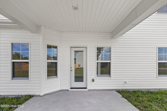 property entrance with a patio area