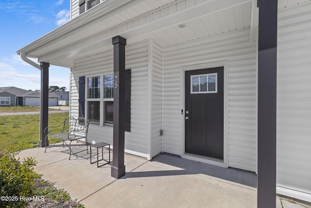 doorway to property with covered porch