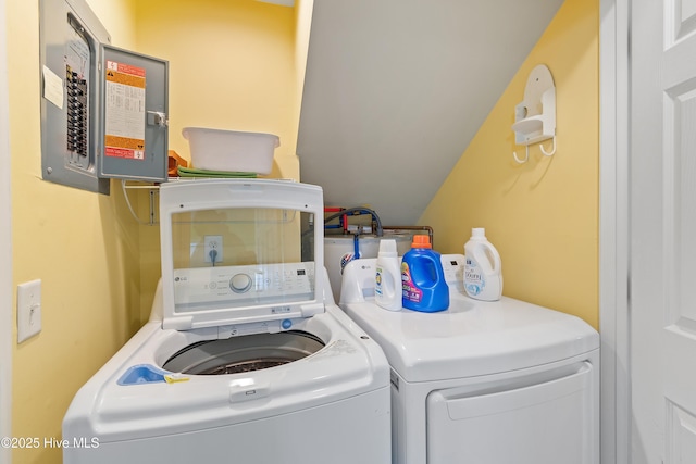 clothes washing area featuring independent washer and dryer and electric panel