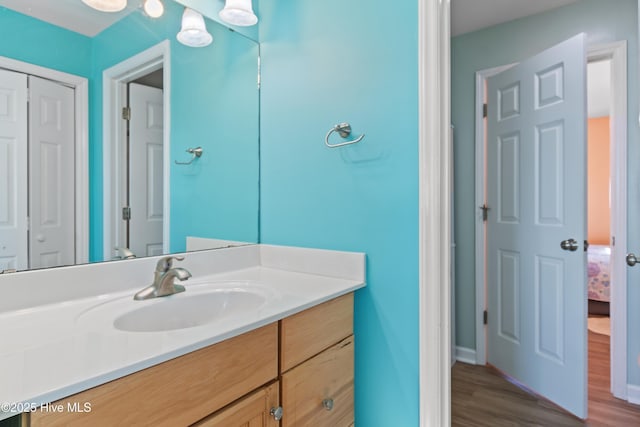 bathroom featuring vanity and hardwood / wood-style flooring