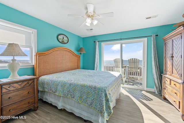 bedroom featuring access to outside, ceiling fan, and light wood-type flooring