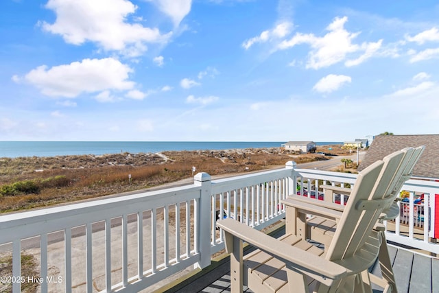 wooden terrace featuring a water view