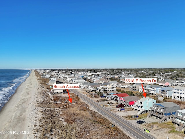 bird's eye view with a water view and a view of the beach