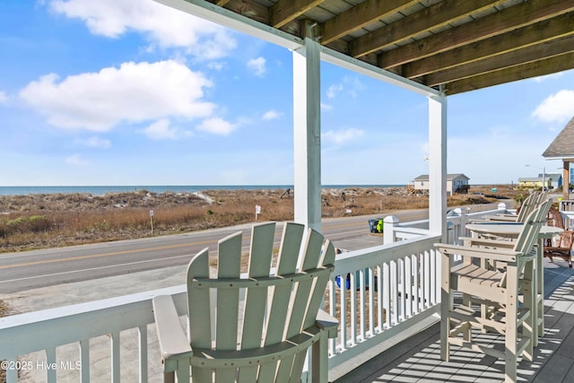 wooden terrace with a water view