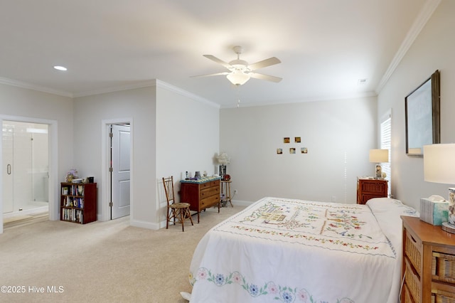 bedroom with carpet floors, ceiling fan, ornamental molding, and connected bathroom