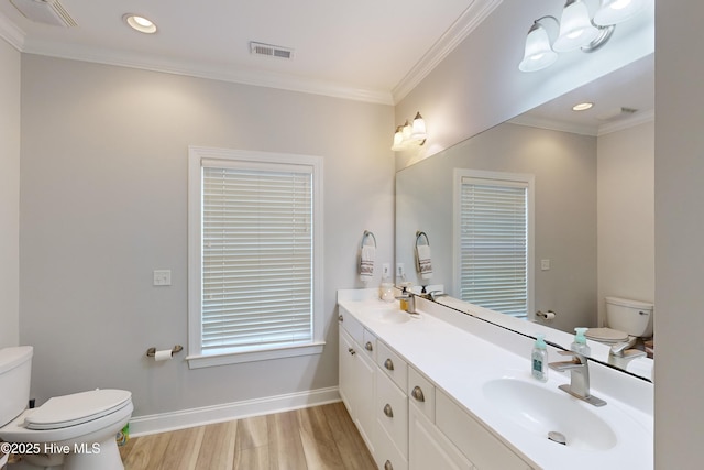 bathroom featuring vanity, toilet, ornamental molding, and wood-type flooring