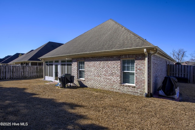 back of property featuring a sunroom