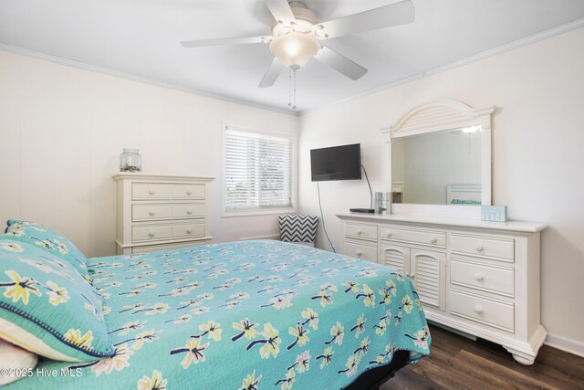 bedroom with dark hardwood / wood-style floors, ceiling fan, and crown molding