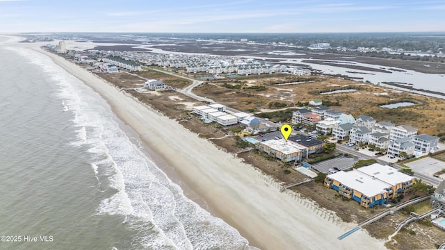 bird's eye view with a water view and a view of the beach