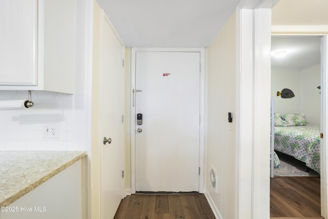 corridor featuring dark hardwood / wood-style floors