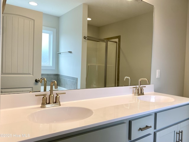 bathroom featuring vanity and an enclosed shower