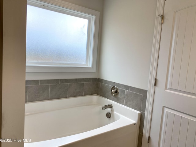 bathroom featuring a tub to relax in