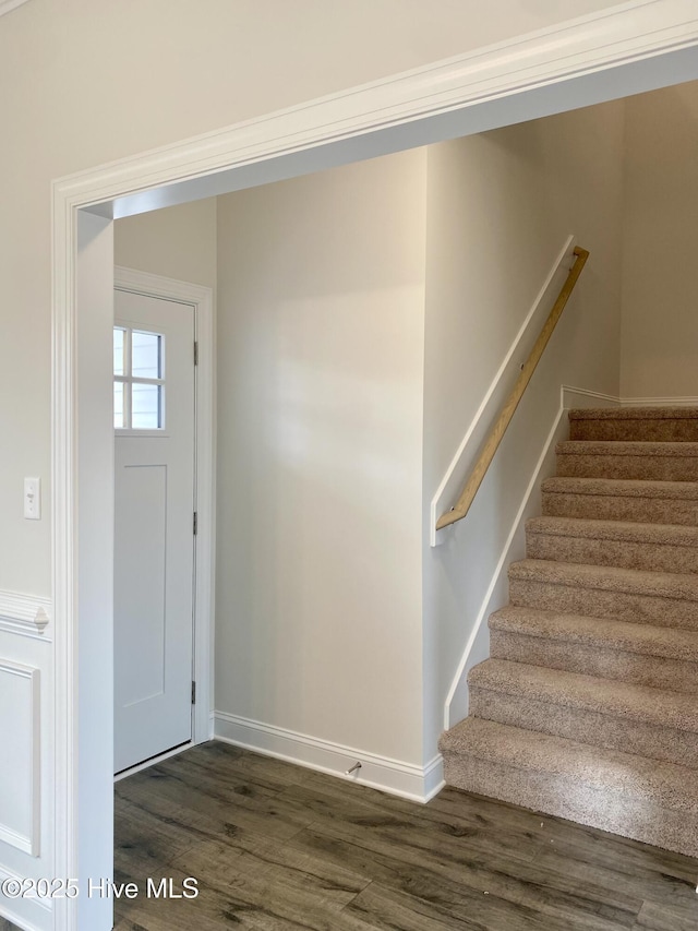 foyer with dark hardwood / wood-style flooring