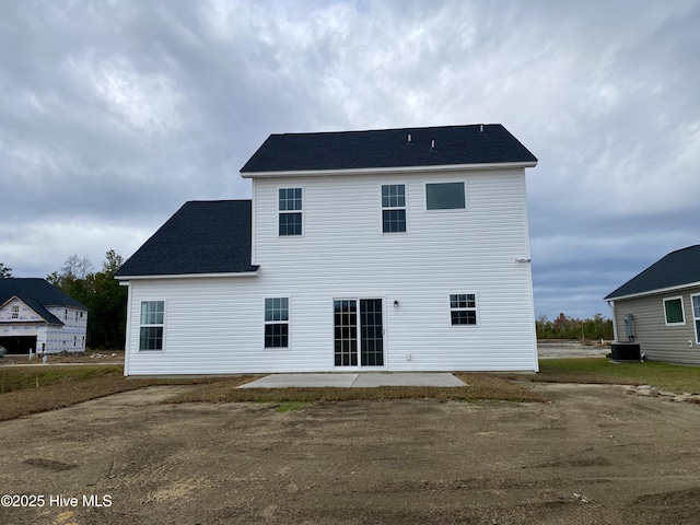 back of house with cooling unit and a patio