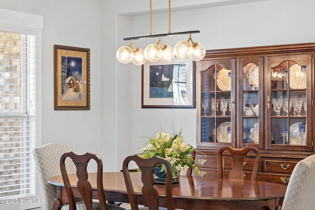 dining space featuring an inviting chandelier