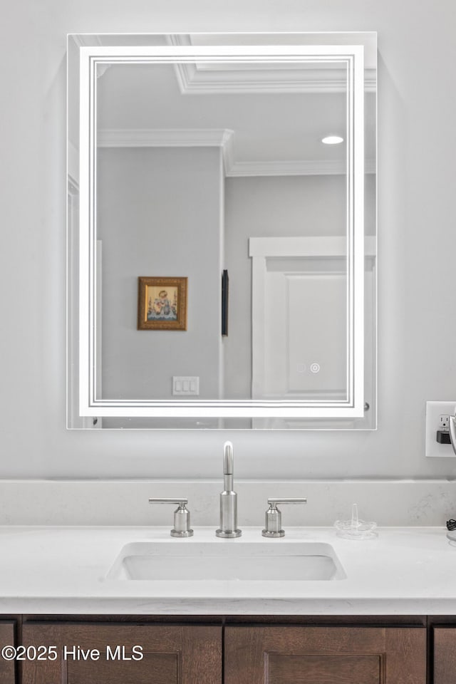 bathroom with vanity and crown molding