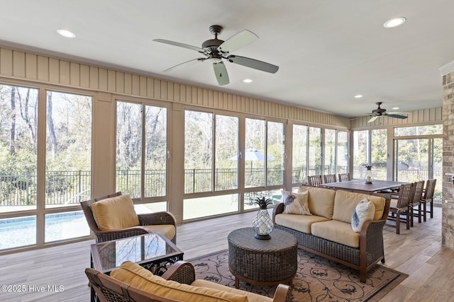 sunroom with ceiling fan