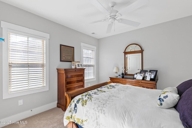 bedroom featuring ceiling fan and light colored carpet