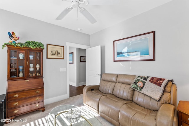 living room with light carpet and ceiling fan