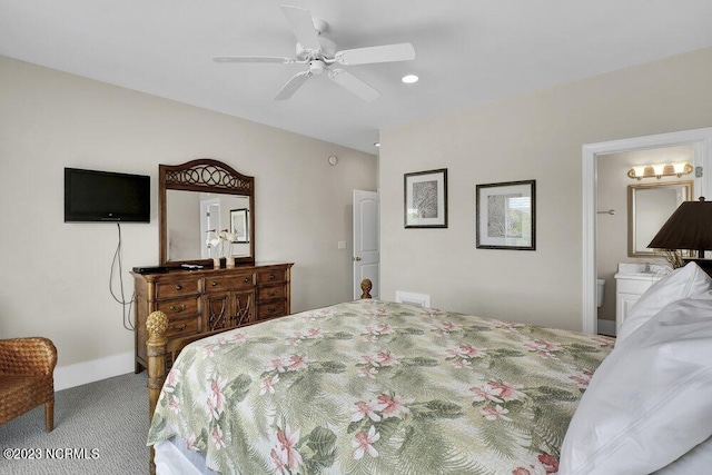 bedroom with carpet flooring, ceiling fan, and connected bathroom