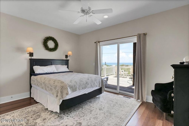 bedroom featuring ceiling fan, dark hardwood / wood-style floors, and access to outside