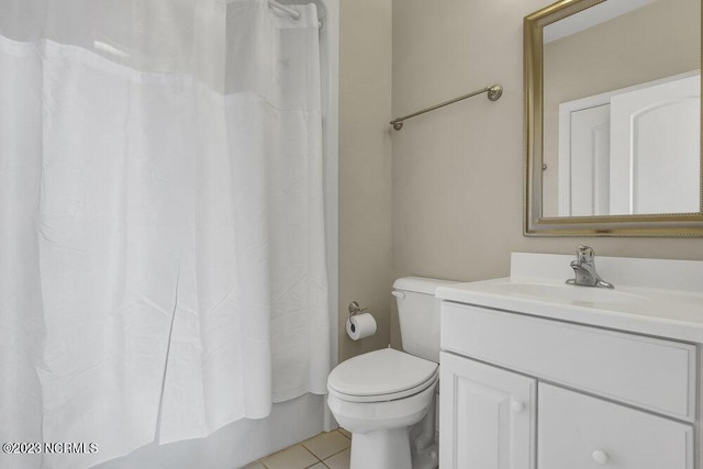 full bathroom featuring toilet, shower / bath combo, vanity, and tile patterned floors