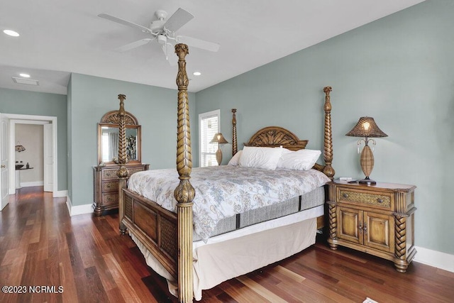 bedroom with ceiling fan and dark hardwood / wood-style flooring