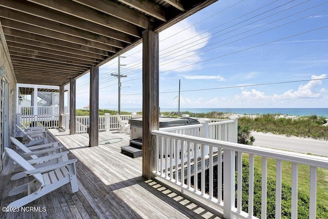 wooden deck with a water view