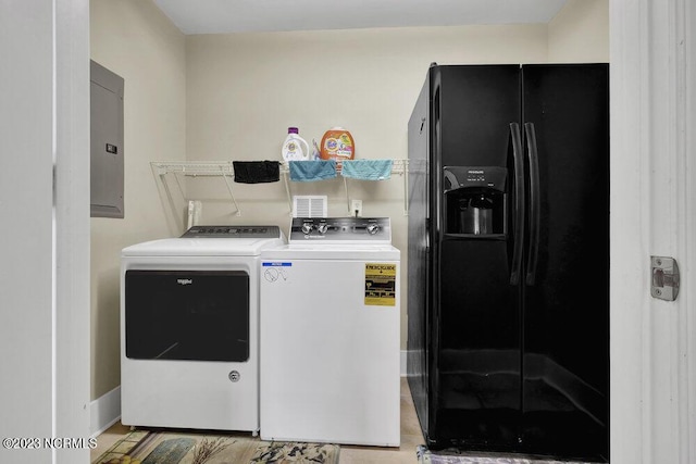 laundry area featuring separate washer and dryer and electric panel