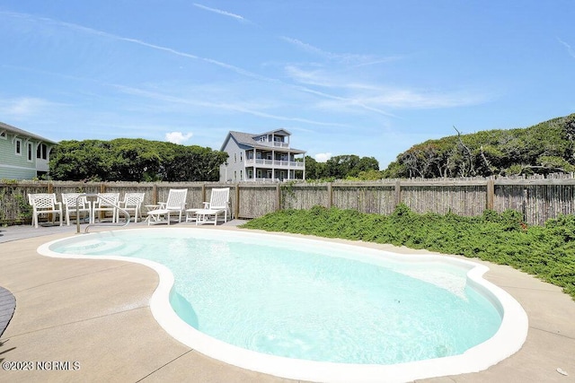 view of swimming pool with a patio area