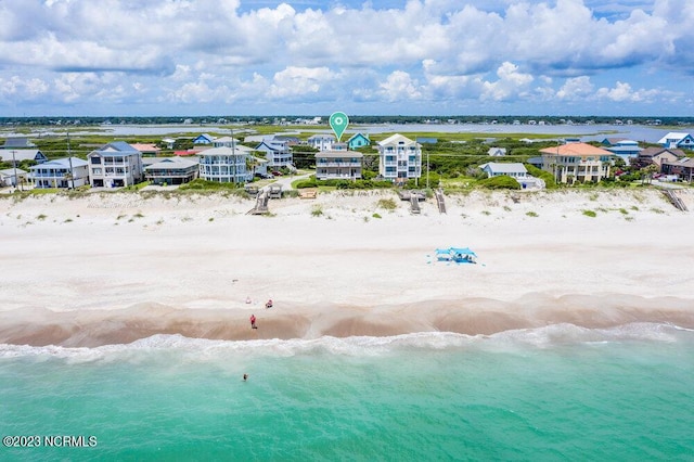 aerial view with a view of the beach and a water view