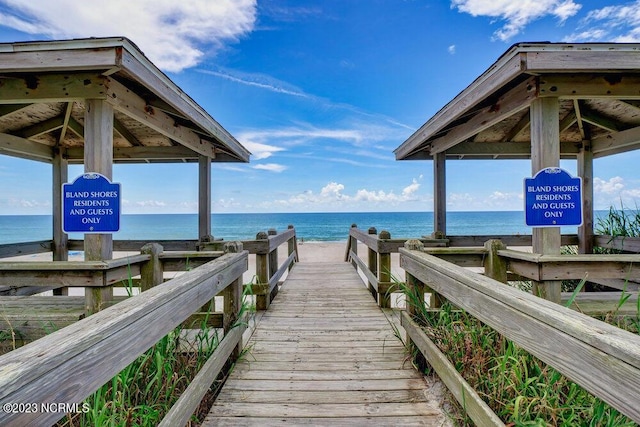 dock area featuring a gazebo and a water view