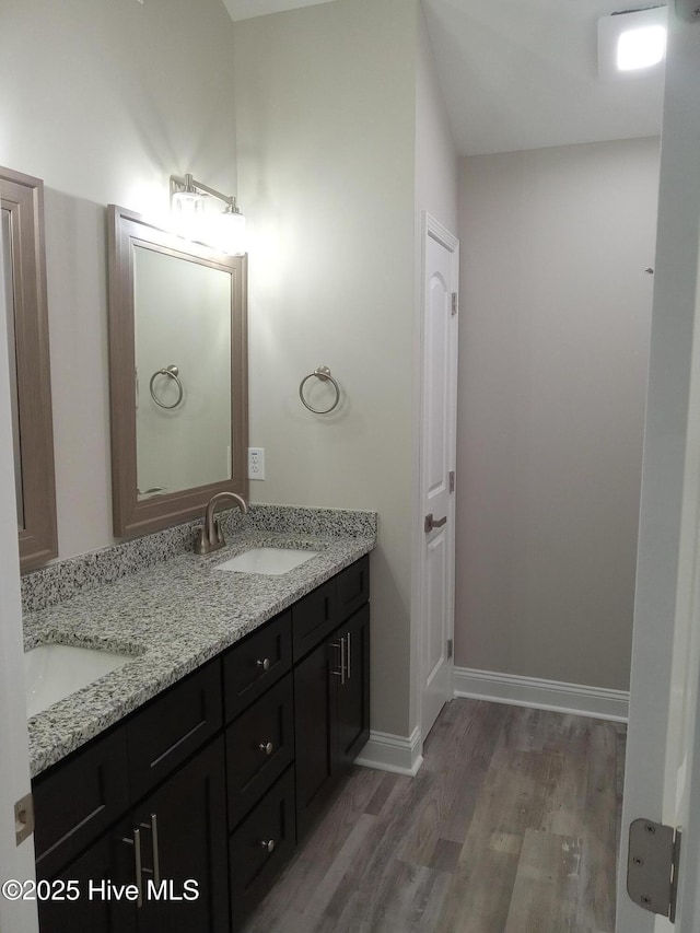 bathroom featuring vanity and hardwood / wood-style flooring