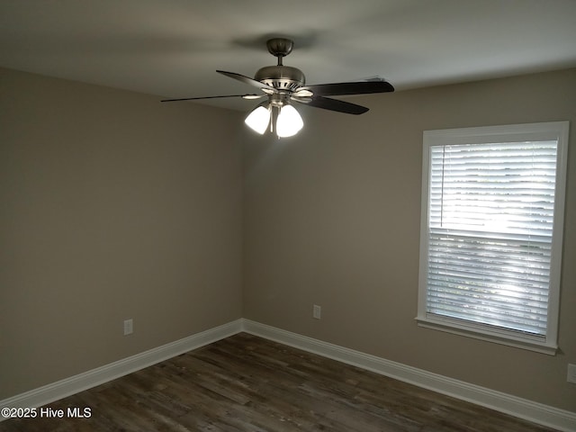 unfurnished room featuring ceiling fan and dark hardwood / wood-style floors