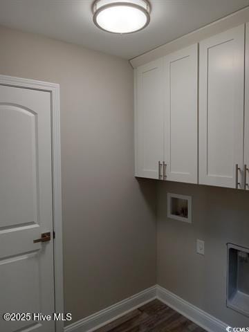 laundry area with dark wood-type flooring, hookup for a washing machine, and cabinets