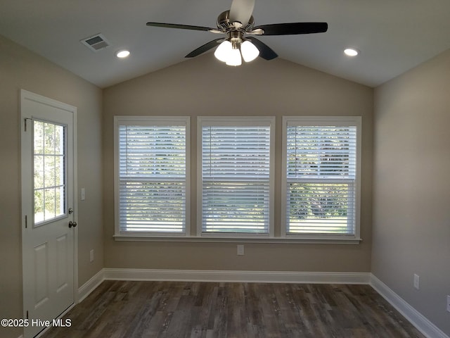 unfurnished dining area with ceiling fan, dark wood-type flooring, and lofted ceiling