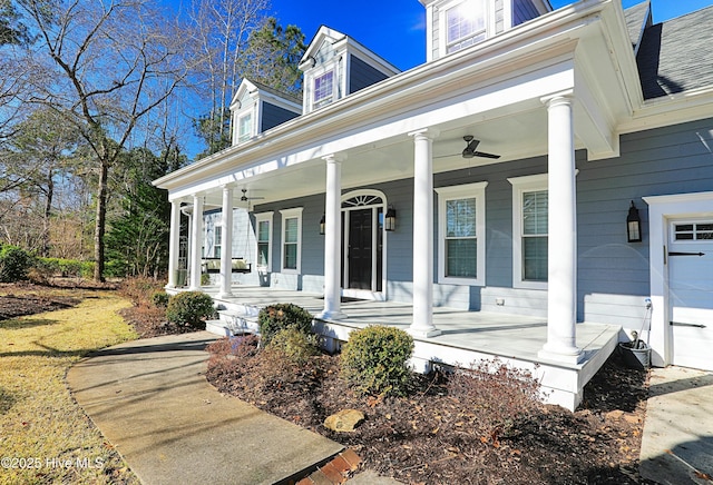 property entrance featuring a porch and ceiling fan