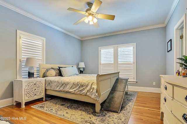 bedroom featuring light hardwood / wood-style flooring, ornamental molding, and ceiling fan