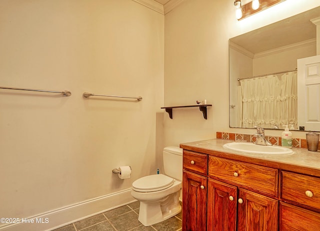 bathroom featuring vanity, tile patterned flooring, ornamental molding, and toilet