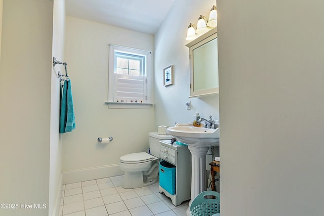 bathroom with sink, tile patterned floors, and toilet