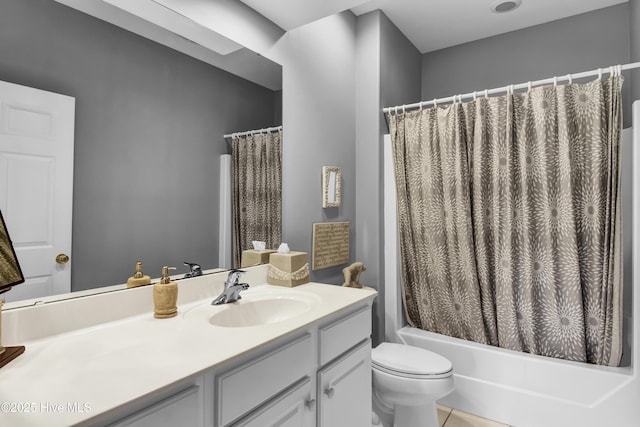 bathroom with toilet, shower / tub combo with curtain, and vanity