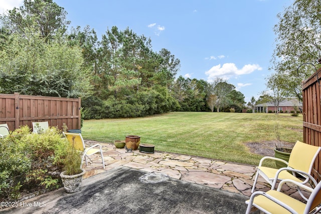 view of yard with a patio and fence