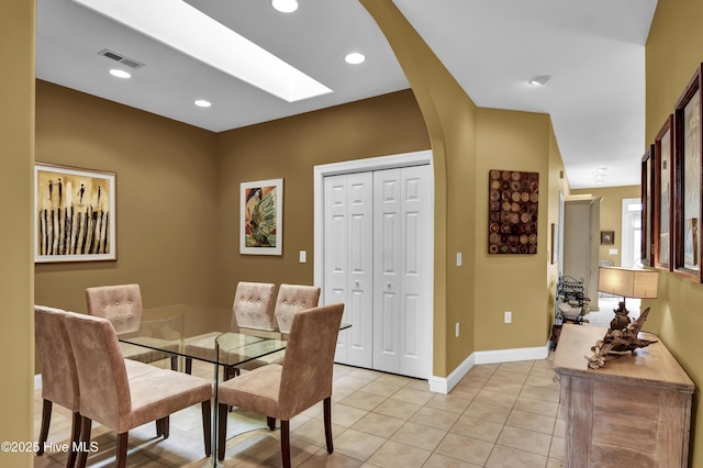 dining area with visible vents, recessed lighting, arched walkways, light tile patterned floors, and baseboards