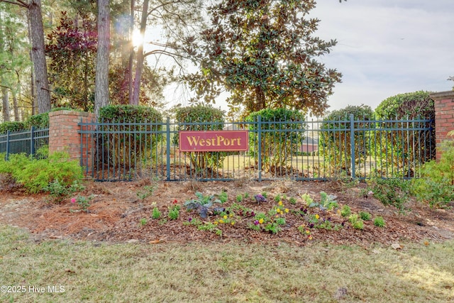 community sign featuring fence