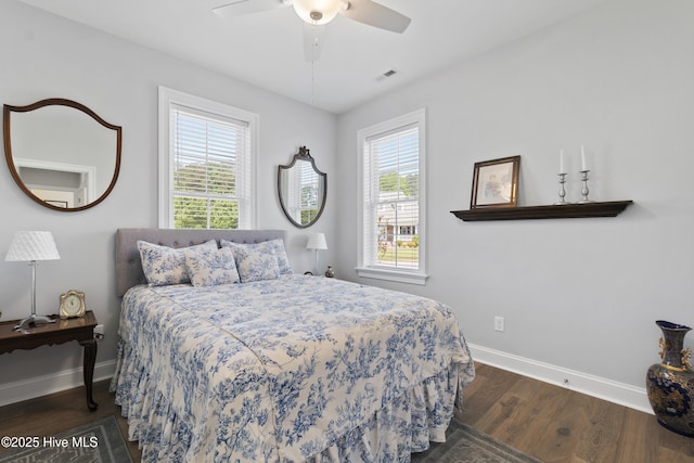 bedroom featuring dark hardwood / wood-style floors and ceiling fan