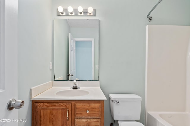 full bathroom featuring vanity, bathtub / shower combination, and toilet