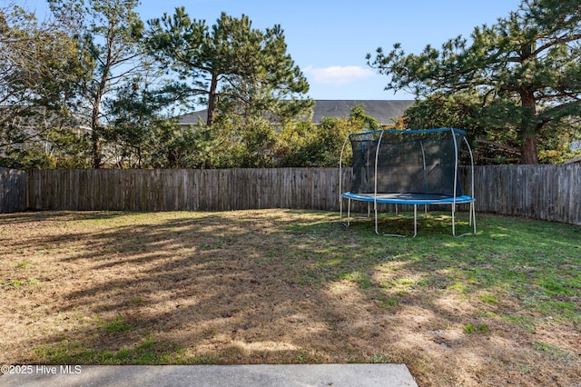 view of yard with a trampoline