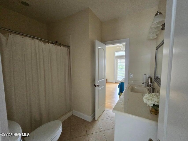 bathroom with tile patterned floors, toilet, and sink